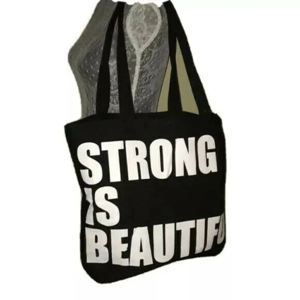 Layer 8 Studio Tote bag Black Strong is Beautifull